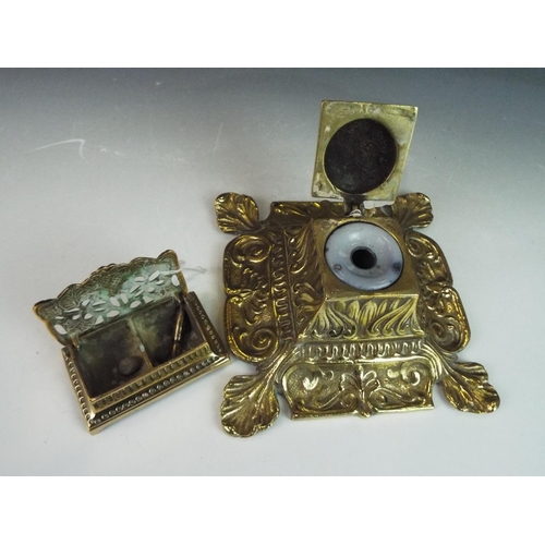 279 - Ornate brass desk set with ceramic inkwell plus stampbox.