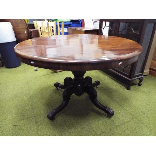 389 - Victorian Flame Mahogany circular tilt table with heavy turned centre column carved with acanthus le... 