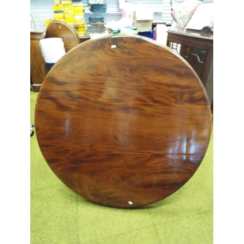 389 - Victorian Flame Mahogany circular tilt table with heavy turned centre column carved with acanthus le... 