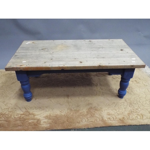 394 - Pretty solid pine coffee table with painted turned legs and frame. Distressed pine top. Measures H:1... 