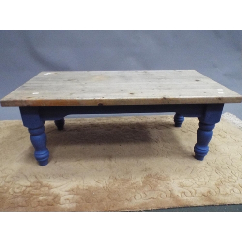 394 - Pretty solid pine coffee table with painted turned legs and frame. Distressed pine top. Measures H:1... 