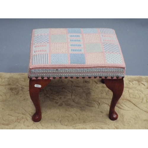 396 - Very pretty upholstered footstool with cabriole legs raised on ball feet. 11 inches tall.