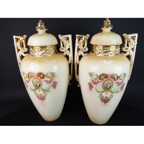 101 - Matched pair of Victorian Blushware lidded Urns with transfer printed flower decoration and hand app... 