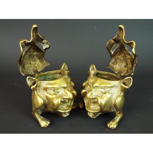 103 - Pair of Victorian Grotesque brass inkwells. Hinged lids. Each approx 3 inches tall.