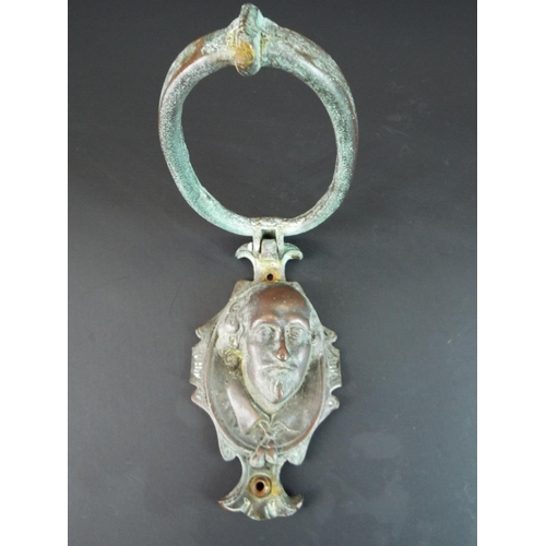 121 - Heavy Solid Bronze door knocker showing the head of William Shakespear.  6 inches long.