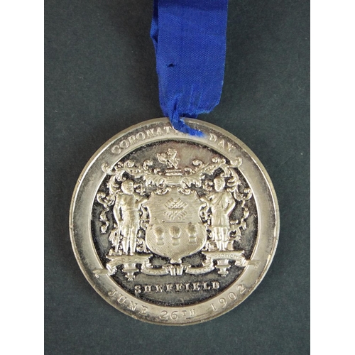 172 - Edward and Alexandra coronation medal 1902 with ribbon.