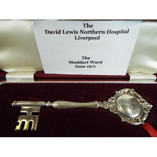 176 - Highly unusual Hallmarked silver presentation key in original case dated 1971 plus a solid brass pre... 