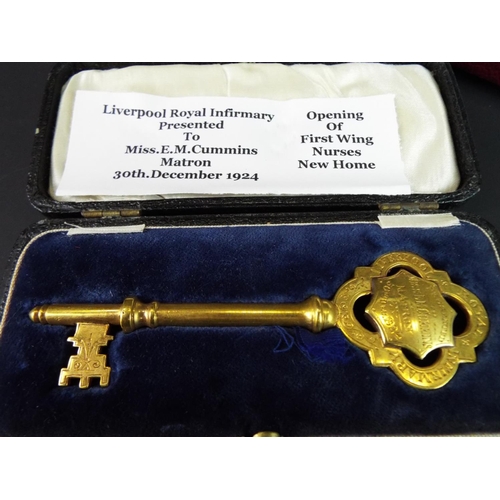 176 - Highly unusual Hallmarked silver presentation key in original case dated 1971 plus a solid brass pre... 