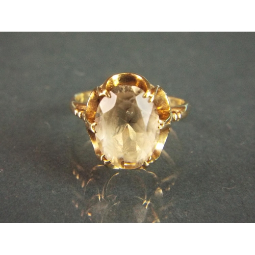 70 - Large citrene set ring (12 x7 mm)  set in an attractive basket form 9ct mount.  Finger size 'L#   3.... 