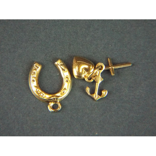 77 - Two 9ct gold charms.