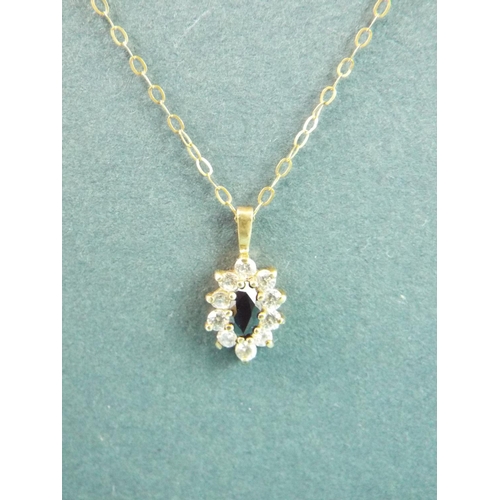 79 - 9ct Sapphire and Stone set pendant set on a 9ct Gold 16 inch chain. Total weight 1.1g