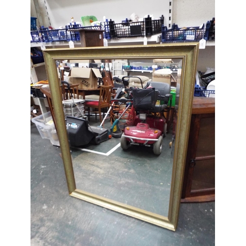 918 - Large bevelled glass mirror measuring 44 X 34 inches.