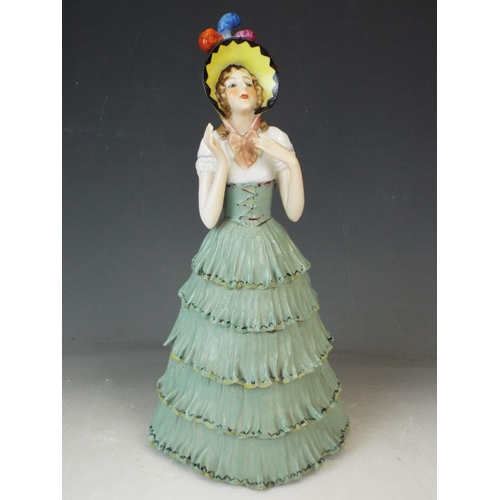 170 - Earthenware glazed figurine of a Period lady with bonnet. 11.5 inches tall. Early 20th Century era.