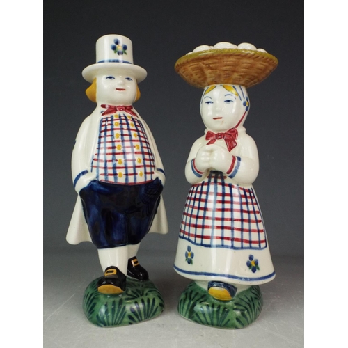 181 - Pair of Danish pottery figural candlesticks of a couple in traditional costume.  6.5 inches tall.