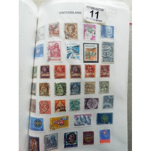 11 - Four part filled albums of assorted world stamps. See photos