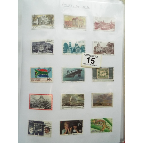 15 - Four part filled albums of assorted world stamps. See photos