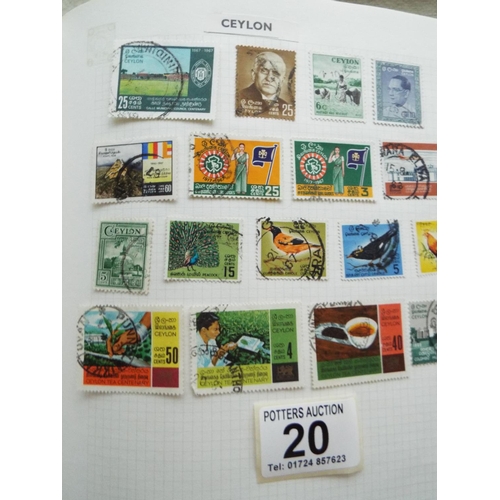 20 - Four part filled albums of assorted world stamps. See photos