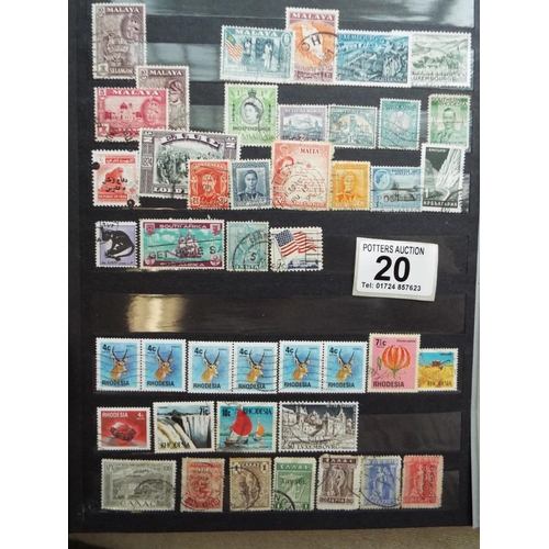 20 - Four part filled albums of assorted world stamps. See photos