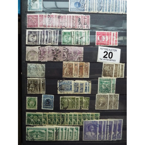 20 - Four part filled albums of assorted world stamps. See photos