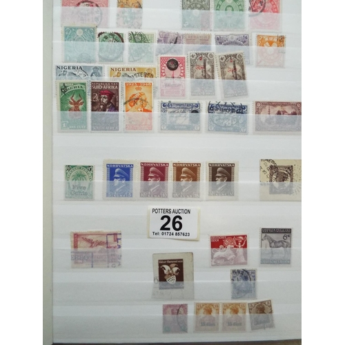 26 - Two Nicely presented, full albums of World stamps.  See photos