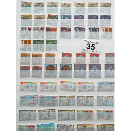 35 - Well filled album of Stock Stamps, Part filled album of Middle Eastern countries plus one other. See... 