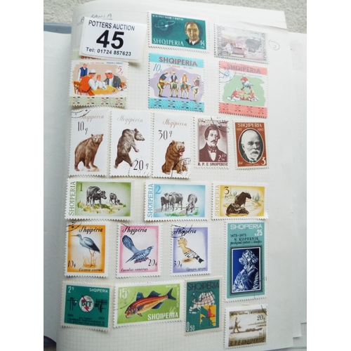 45 - Four small but well filled albums of World Stamps to include GB. See photos