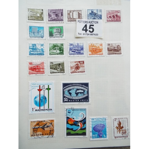 45 - Four small but well filled albums of World Stamps to include GB. See photos