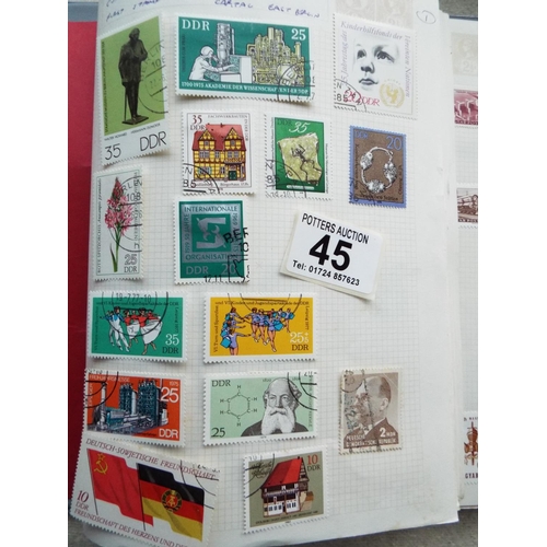 45 - Four small but well filled albums of World Stamps to include GB. See photos