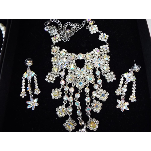 68 - Four good Quality statement costume necklace sets in boxes plus a large pair of 925 Silver ear hoops... 