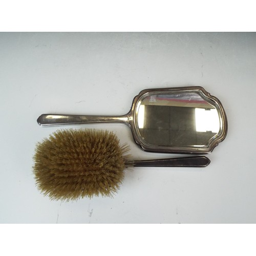 71 - Solid Silver Dressing table mirror and matching handbrush. Both hallmarked for Chester 1940 by Walke... 