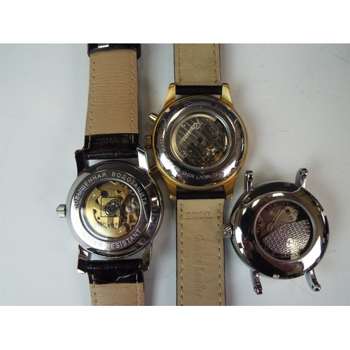 98 - Three Automatic mechanical skeleton watches all in running order. See photos