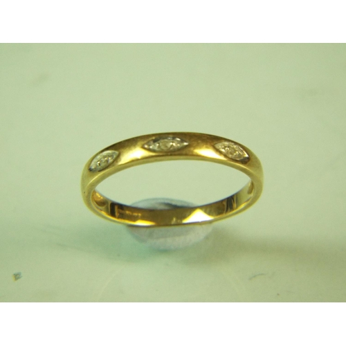 111 - 9ct Yellow gold triple stone set band. Finger size 'N-5'      1.5g