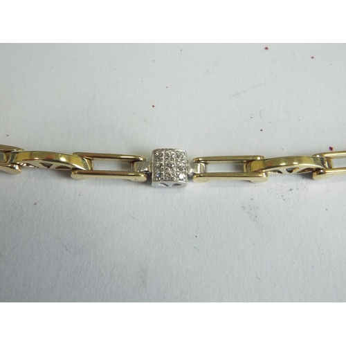 127 - 9ct Yellow Gold CZ set Link Bracelet. 10.2g