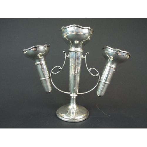 133 - Hallmarked silver table centrepiece with a trio of vases on scrolled silver frame. Marks for Birming... 