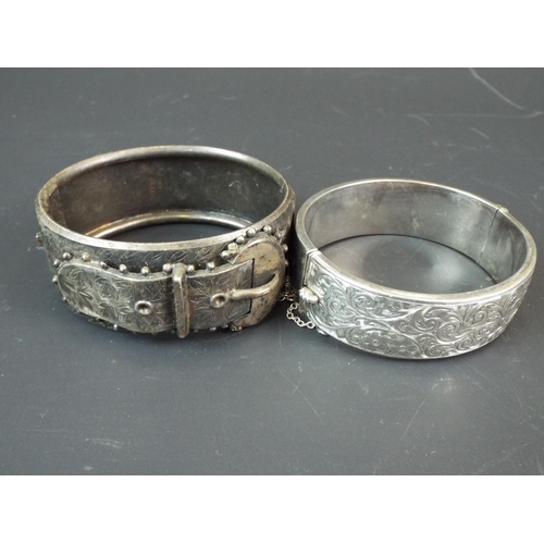 149 - Two Vintage Silver bangles, one with safety chain plus hollow silver bangle. Total weight. 76.3g