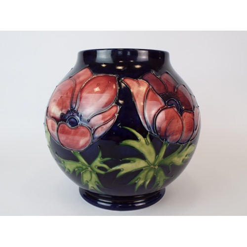 13 - Vintage Moorcroft vase in the Anenome pattern. 7 inches tall. Excellent conditon free from any fault... 