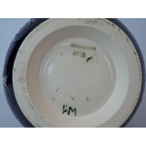 13 - Vintage Moorcroft vase in the Anenome pattern. 7 inches tall. Excellent conditon free from any fault... 