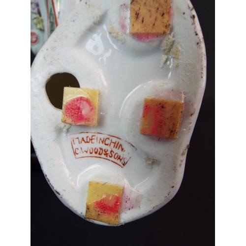 24 - Trio of porcelain Oriental ladies. Each standing on a carved hardwood plinth. Each measures 13 inche... 