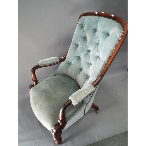 54 - Edwardian era upholstered armchair with original castors.