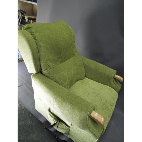 56 - Electric twin motor rise and recline chair upholstered in green fabric. Working order.