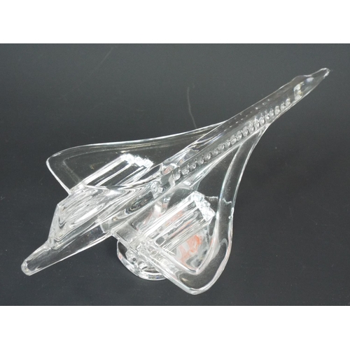 7 - Solitaire Lead Crystal model of Concorde standing on ebonised base. 9 inches long