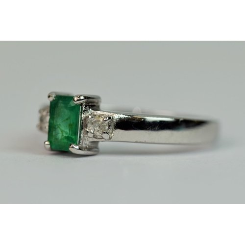 304 - 9ct White Gold Ring set with an Emerald with Diamond Shoulders.  Finger size 'M-5'  2.5g