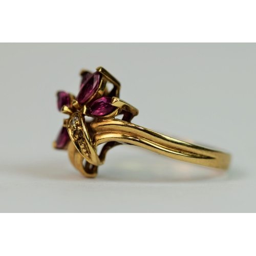 310 - 9ct Yellow Gold Ring set with Diamond and Ruby set in a flower pattern. Finger size 'M'  2.5g Small ... 