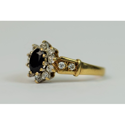 316 - 9ct Yellow Gold Ring set with Sapphire and CZ   Finger size 'L-5'   2.2g