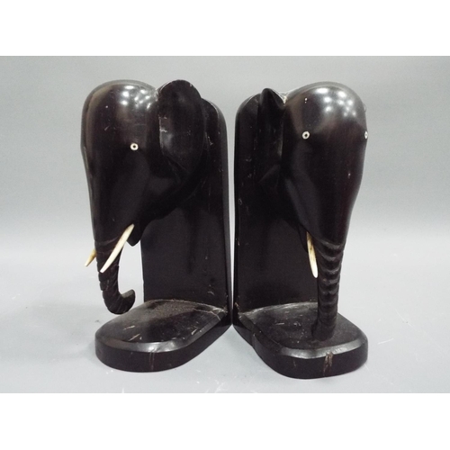 267 - Pair of Ebony elephant bookends (1 tusk missing).