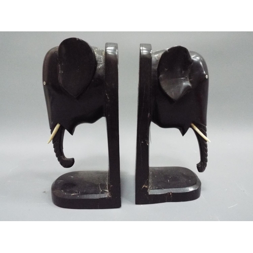 267 - Pair of Ebony elephant bookends (1 tusk missing).