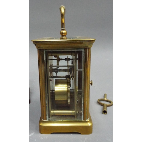 268 - Vintage brass carriage clock with skeleton movement in running order. Plus 1 other clock.