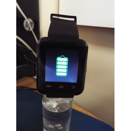 383A - Smart watch with original box, charger and paperwork, appears to be in unused condition. see photos.