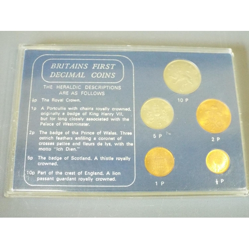 143 - 4 Sets of Britains first decimal coins and 1 set of Coinage of Great Britain. (6)