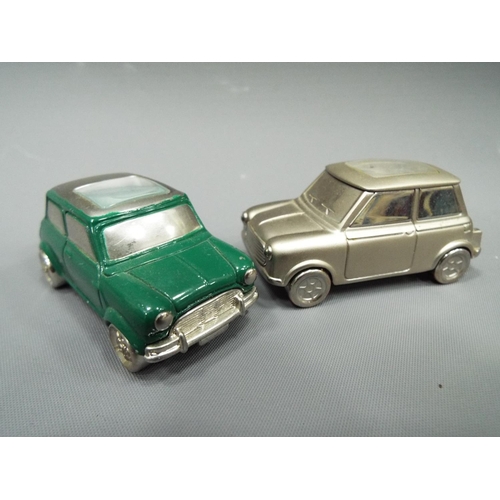 403 - Two Die cast metal minis with quartz clocks set into the roofs. Will need batteries to run. See phot... 